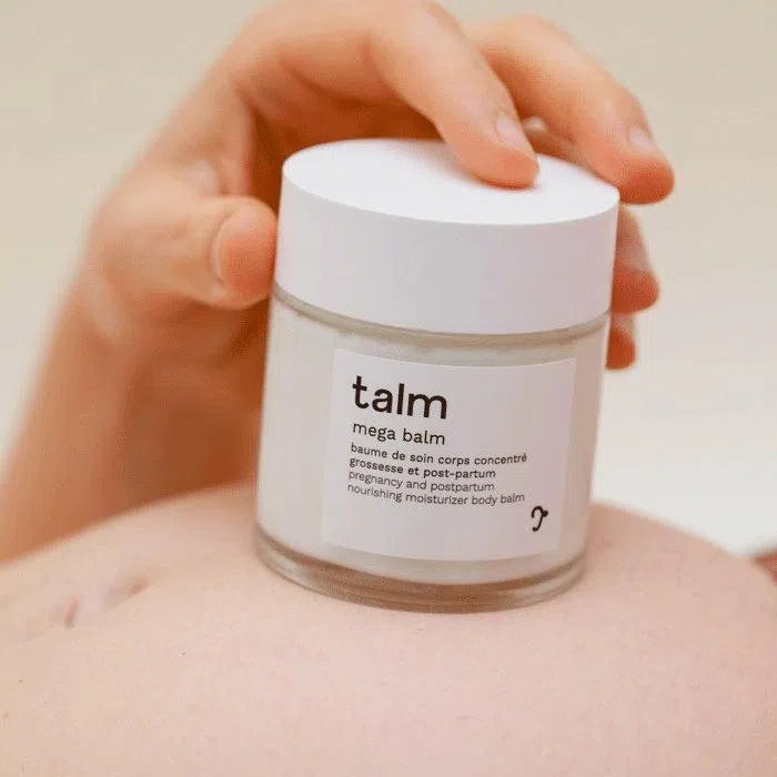 Baume hydratant visage et corps  contre vergetures pour grossesse et post partum de Talm sur ventre femme enceinte