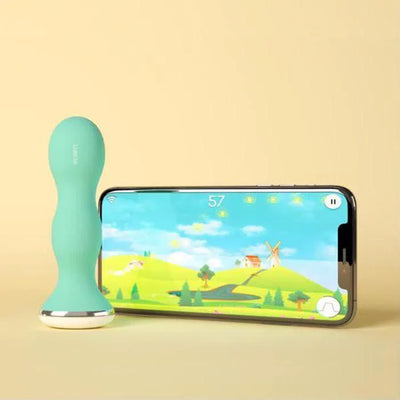 Sonde périnéale bleu de Perifit pour muscler périnée à côté d'un téléphone connecté sur l'application