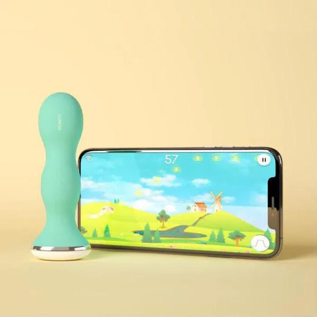 Sonde périnéale bleu de Perifit pour muscler périnée à côté d'un téléphone connecté sur l'application